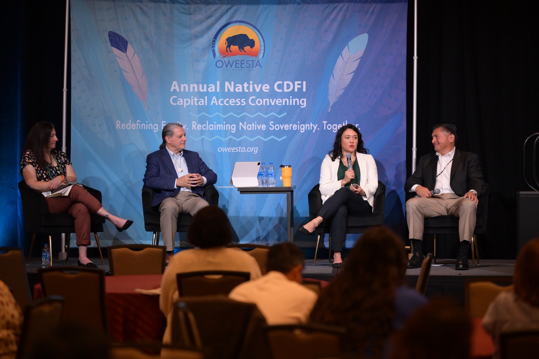 Lauren Grattan speaking on a panel at Oweesta Corporation's 9th Annual Native CDFI Capital Access Convening