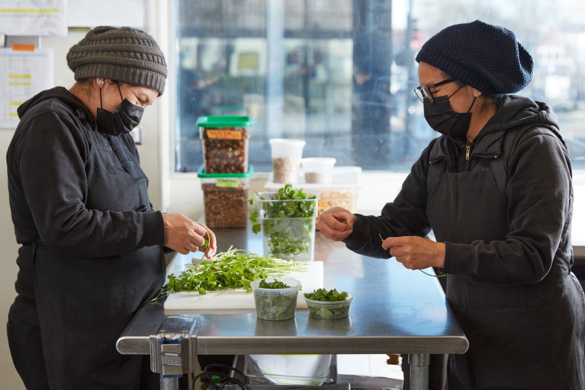 Just Fare workers prepping in the kitchen